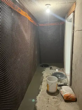 Interior waterproofing system installation